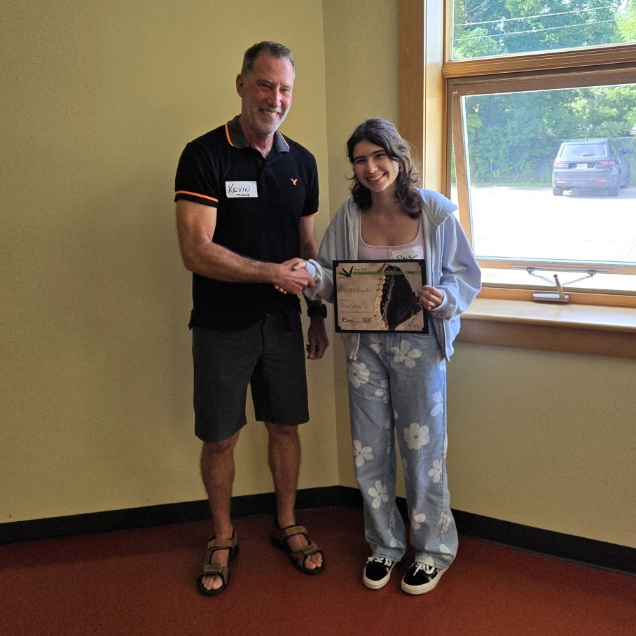 Brandy Lake Association Director Kevin Trimble (L) presents Paige Stevens with the stewardship award.