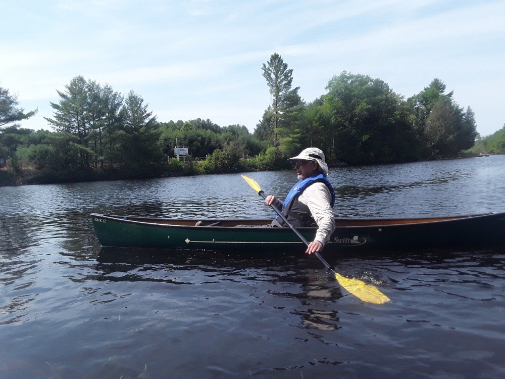 A photo of Norman Yan enjoying his canoe and thinking about Muskoka’s wonderful water.